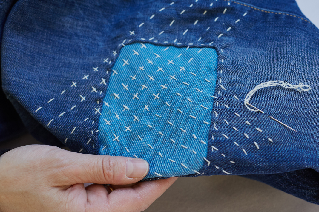 Repair denim with visible mending