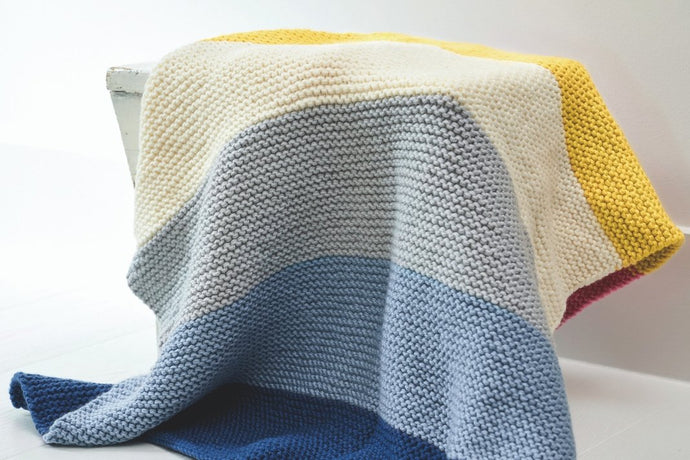 Knit a cosy striped blanket