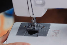 Load image into Gallery viewer, Close-up of the head of a sewing machine.
