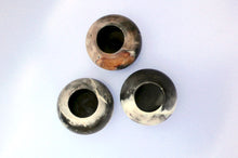 Load image into Gallery viewer, Top view of three unique smoke-fired ceramic bowls.
