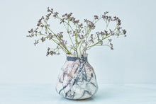 Load image into Gallery viewer, A smoke-fired ceramic vase with small purple flowers.
